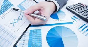 Accountant reconciling VAT and corporate tax records